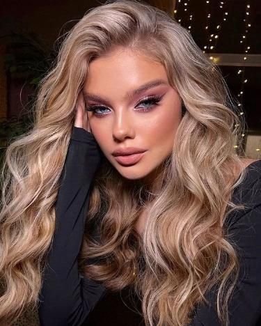Extensiones rubia wavy largo